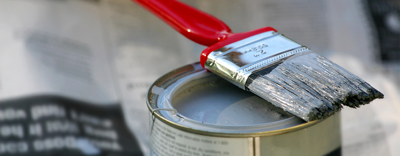 Paint brush on top of paint can